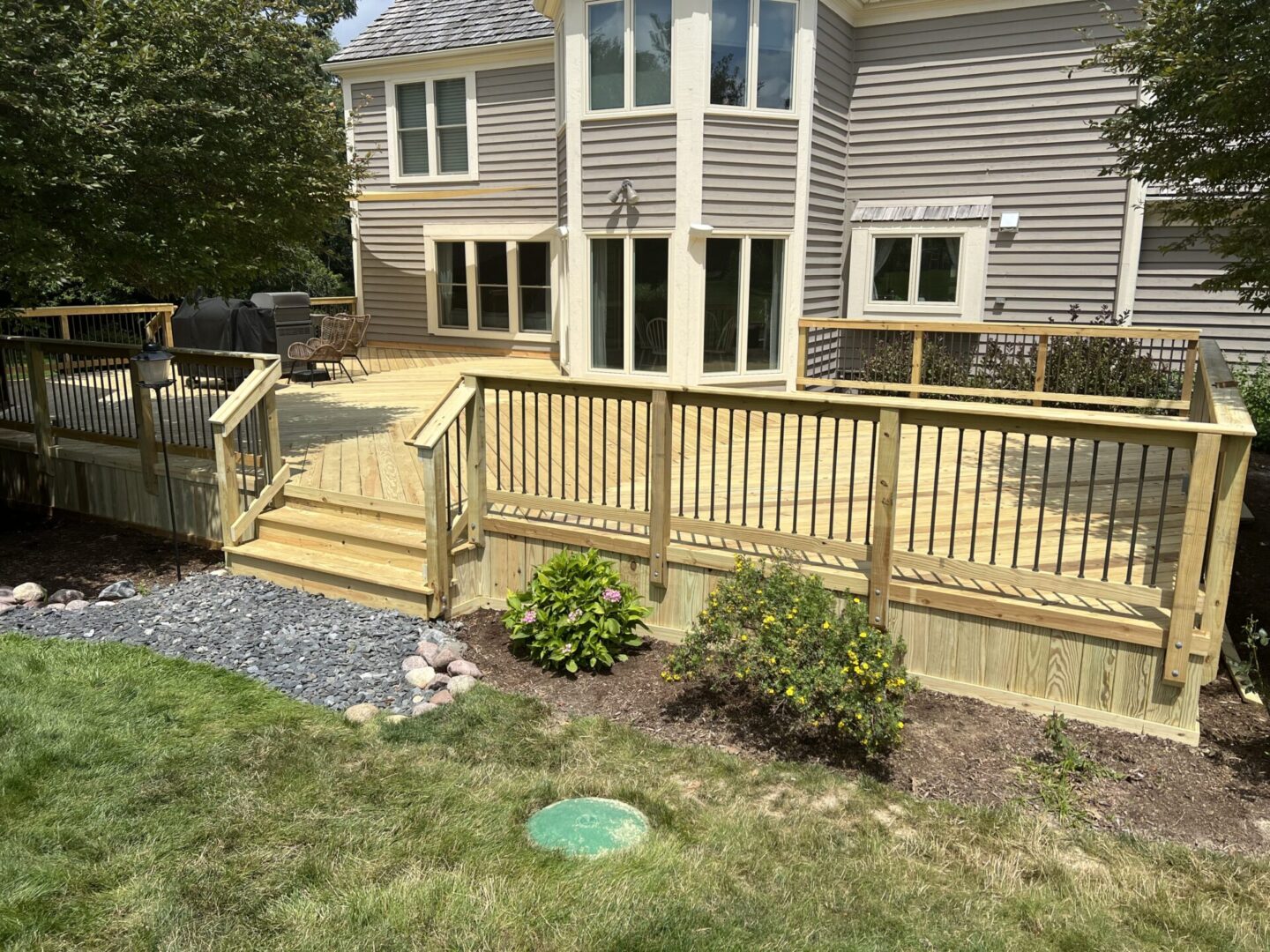 A house with a deck and patio in it