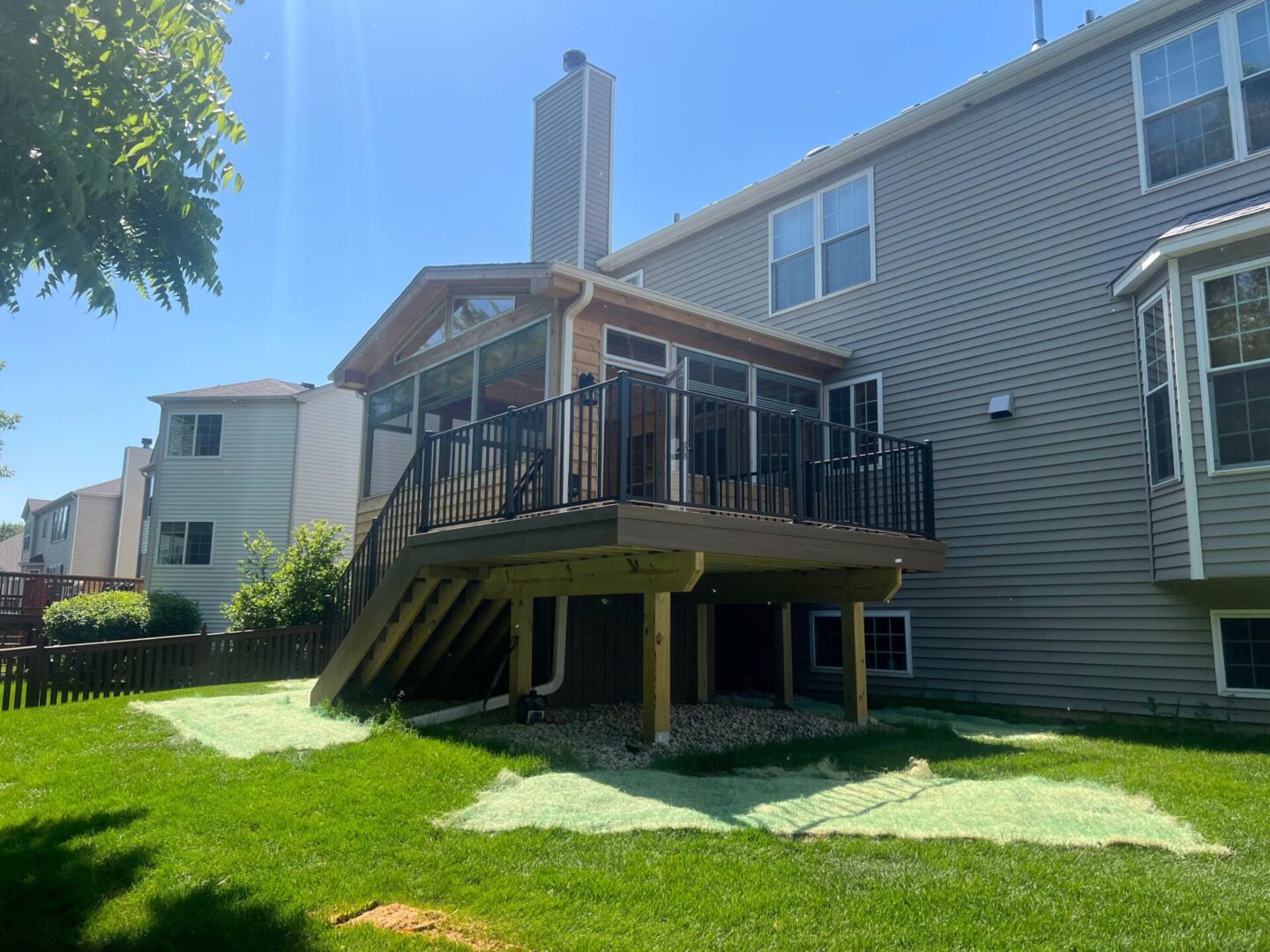 A large deck with stairs leading to the back of it.